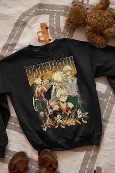 Katsuki Bakugo Sweatshirt, Kacchan, My Hero Academia Black T-shirt With Character Print For Winter, Black Character Print T-shirt For Winter, Anime Print Crew Neck Tops For Fandom, Black Anime Print Crew Neck Sweatshirt, Casual Cartoon Print Sweatshirt For Fans, Long Sleeve Character Print Fan Apparel Top, Long Sleeve Fan Apparel Top With Character Print, Pop Culture Anime Print Crew Neck Tops, Black Cotton Sweatshirt With Character Print