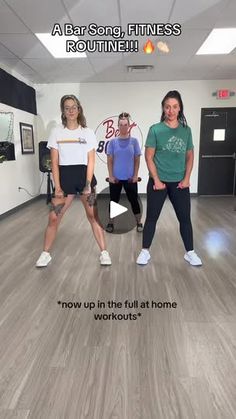 three women are doing exercises in an office