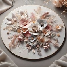 a white plate topped with lots of flowers on top of a cloth covered tablecloth