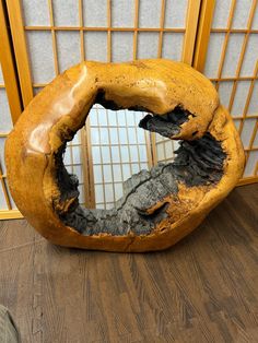 a large piece of wood that has been carved to look like it is in the shape of a bagel