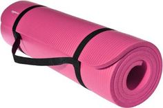 a pink yoga mat with black straps