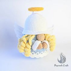 a crocheted angel hat with yellow wings