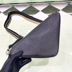 SHOP MORE LUXURY PRODUCTS HERE Description Prada Saffiano Triangle Bag Black For Women, Women’s Bags 11in/28cm 2VH155_2FAD_F0002_V_OOO This triangular bag in Prada’s emblematic geometric shape is made of Saffiano , an iconic material of the brand defined by its crosshatch texture and waxed finish. The triangle logo is also found in the embossed macro detail decorating the front. The Re-Nylon lining, an innovative fabric made of regenerated nylon yarn, completes the design. Size: 28 x Office Bag With Adjustable Strap In Saffiano Leather, Office Saffiano Leather Shoulder Bag With Adjustable Strap, Business Shoulder Bag With Adjustable Strap In Saffiano Leather, Business Shoulder Bag In Saffiano Leather With Removable Pouch, Business Shoulder Bag With Removable Pouch In Saffiano Leather, Saffiano Leather Crossbody Shopping Bag, Saffiano Leather Shoulder Bag With Removable Pouch For Business, Saffiano Leather Rectangular Bag With Adjustable Strap, Designer Saffiano Leather Shoulder Bag With Detachable Strap