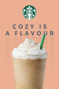 a starbucks drink with whipped cream and a green straw in it's cup on an orange background that says cozy is a flavor