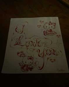 a piece of paper with writing on it that says i love you and two cats