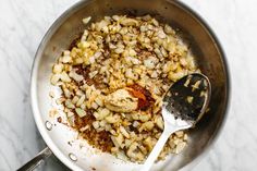 the food is being prepared in the pan on the stove top and ready to be eaten