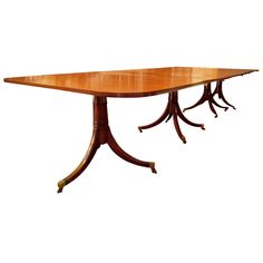 a wooden table with four leaves on it