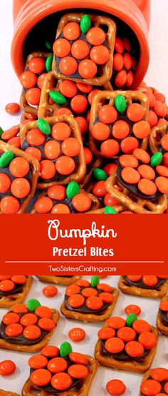 pumpkin pretzel bites are stacked on top of each other with candy in the middle