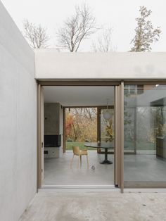 an open living room and dining area with sliding glass doors