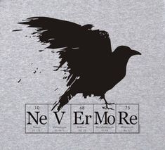 a black bird sitting on top of a gray t - shirt that says nev er more