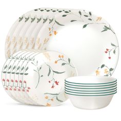 a set of dinnerware with flowers on it