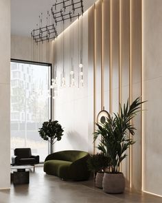 a living room filled with furniture next to a tall window