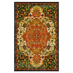 an orange, green and yellow rug with ornate designs on the bottom half of it