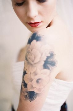 a woman with flowers on her arm