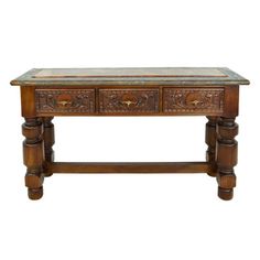 an old wooden table with two drawers on one side and a marble top on the other