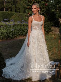 a woman in a wedding dress posing for the camera