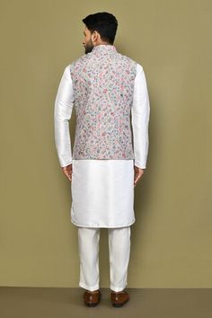 Sea green sleeveless bundi with floral print and stitchline thread embroidery. Paired with white full sleeve kurta and pant. - Aza Fashions Sleeveless Nehru Jacket With Chikankari Embroidery For Diwali, Sleeveless Nehru Jacket With Chikankari For Diwali, Sleeveless Embroidered Nehru Jacket For Diwali, Embroidered Sleeveless Nehru Jacket For Diwali, Spring Sleeveless Nehru Jacket With Chikankari Embroidery, Fitted Sleeveless Kurta With Floral Embroidery, Sleeveless Cotton Nehru Jacket With Resham Embroidery, Sleeveless Nehru Jacket For Spring Wedding, Sleeveless Floral Embroidered Kurta For Spring