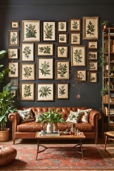 a living room filled with furniture and lots of framed pictures on the wall above it