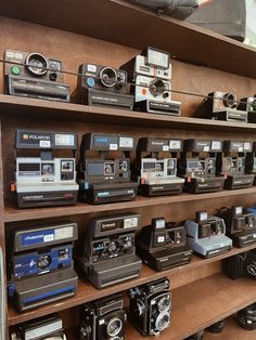 many old cameras are on display in a store