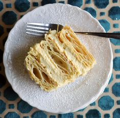 a piece of cake on a plate with a fork