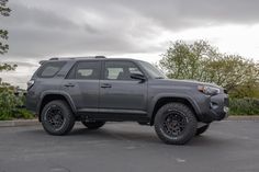 a gray toyota truck parked in a parking lot