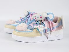 Step into a world of whimsy and charm with these enchanting sneakers that seamlessly blend playful kawaii aesthetics with unique design elements. The upper of the sneakers features adorable plush kitty claw embellishments, adding a touch of cute and cuddly flair to your every step. At the heel, angel wing decorations gracefully extend, giving an ethereal feel to the sneakers and making you feel as if you're walking on clouds. To top off this delightful design, the sneakers come adorned with Cinn Cute Multicolor Low-top Sneakers, Cinamonroll Sanrio Shoes, Kawaii Shoes Cinnamoroll, White Kawaii Synthetic Sneakers, Pink Harajuku Sneakers For Spring, Dolls Kill Sugar Thrillz Shoes, Angel Wings Decor, Claw Gloves, Steampunk Fashion Male