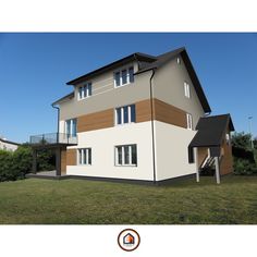 a two story house with brown and white sidings