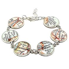 a map bracelet with four charms on it