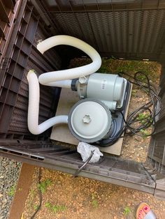 the inside of a storage container with an air pump and hoses attached to it