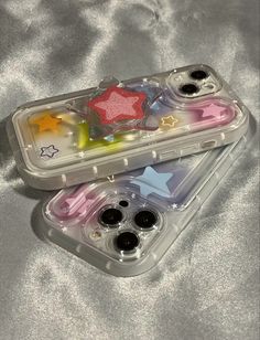 two plastic containers with different colored stars in them