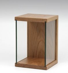 a wooden box with glass inside on a white background