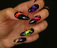 "Neon smoke nails, eye-catching and outstanding! These smoke black nails are perfect for parties and concerts. Have the fun of your life while wearing these extravagant colorful and fun painted nails that will dazzle your friends! Choose from the matte of shiny topcoat.  Medium almond nails showed. To see the full collection of nails visit the website at www.onyxnailsdesign.com These re-usable press-on nails or glue-on nails are crafted with the highest professional quality products available and can be reused over and over.   Copy this link on Youtube to watch a short video on \"how to measure the nails\". https://youtu.be/MiPpJPH_29w Choose between Long Coffin, Long Stiletto, Medium Coffin, Medium Almond, Medium Round, Medium Square, Short Oval or Short Soft Square.  All our products are Black And Neon Nails, Music Festival Nails, Neon Nail Art, Neon Acrylic Nails, Neon Nail Designs, Acrylic Press On Nails, Rainbow Nails, Festival Nails, Neon Nails