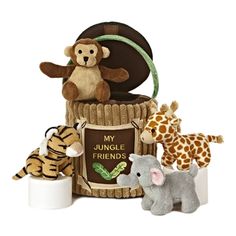 several stuffed animals are sitting in front of a sign that says, my jungle friends