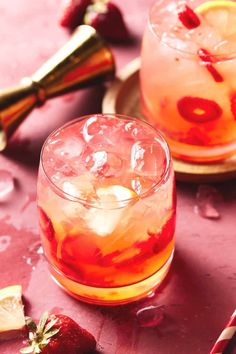 two glasses filled with ice and strawberries