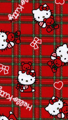 a hello kitty plaid fabric with hearts and bows on the front, in red and green