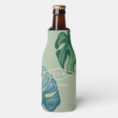 a bottle with a green leaf design on it