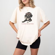 Weenies & Martinis - Dachshund Lover T-Shirt .: The Comfort Colors 1717 tee is made with medium fabric (6.1 oz/yd² (206.8 g/m consisting of high quality, 100% ring-spun US cotton for long-lasting comfort. .: The relaxed fit keeps the wearer comfy in both casual and semi-formal settings while the crew neckline delivers that classic, neat style which makes it perfect for accessorizing.  .: The pre-shrunk fabric ensures a consistently great fit. Check all available sizes in our Comfort Colors 1717 Summer Relaxed Fit T-shirt With Dog Print, Summer Dog Print Relaxed Fit T-shirt, Relaxed Fit Short Sleeve Tops With Dog Print, Dachshund Shirt, Dachshund Mom, Dachshund Lovers, Semi Formal, Martini, Dachshund