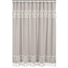 a white shower curtain with fringe trim