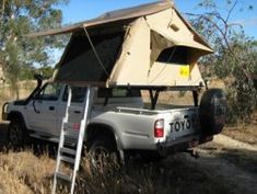 a truck with a tent attached to the back