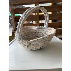 a basket sitting on top of a white table