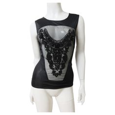 A fabulous black beaded top from Jean Colonna. It is sleeveless with a crew neckline and a front sheer panel adorned with an elaborate pattern of black glass tubular, seed and round beads. Gorgeous. The back is solid opaque black. Fits sizes Extra Small, Small. Bust 36-37" Length 25" Dream Wishlist, Creation Station, Beaded Top, Black Fits, Small Bust, Black Glass, Black Beads, Round Beads, Crew Neckline