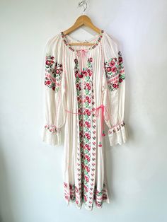 Ulla Johnson Pink Floral Cross Stitched Dress! A beautiful piece! It is the "Filia Dress" in 100% cotton. Features long-sleeves, a pom-pom tie on the collar, and a matching belt. Unlined. Made in India. Marked a size 6, but could fit up to a medium. In excellent condition! Approx. Measurements: Underarm to Underarm: 21" Waist: 56" Length: 48" White Peasant Embroidered Long Sleeve Dress, White Long Sleeve Peasant Embroidered Dress, Spring Peasant Long Dress, Spring Long Peasant Dress, Long Peasant Spring Dress, Long Sleeve Folk Peasant Dress For Spring, Peasant Long Sleeve Festival Dress, Long Sleeve Embroidered Peasant Dress, Spring Long Sleeve Dresses With Tassel Ties