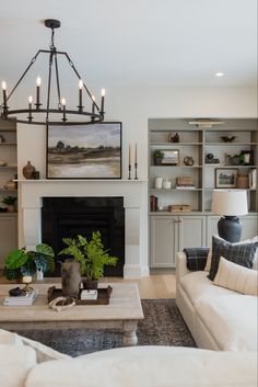 a living room filled with furniture and a fire place