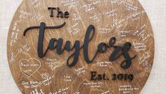 a wooden plaque with the names and dates of taylor's estate in cursive writing