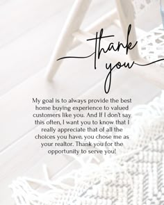 a thank card with the words,'thank you'written in cursive ink