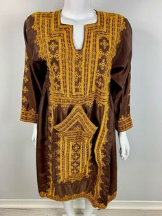 Afghan Vintage Balochi Embroidered Dress Size: Length: 40 inches  Bust (front): 19 Sleeve Length: 19 Shoulders:15 Yellow Embroidered Long Sleeve Kaftan, Traditional Brown Dresses With Resham Embroidery, Fitted Embroidered Dress With Geometric Embroidery And Long Sleeves, Traditional Brown Embroidered Dress, Brown Long Sleeve Traditional Dress, Brown Long Sleeve Kaftan For Festival, Balochi Dress, Embroidered Dress, Dress Clothes For Women