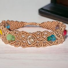 a close up of a bracelet on a table