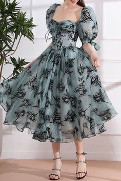 Unleash your inner elegance with our Corset Floral Print Organza Midi Dress. Featuring a delicate organza fabric adorned with a beautiful floral print, this dress exudes luxury. Add a touch of drama by attaching the removable puff sleeves, perfect for any special occasion. Elevate your style with this sophisticated and exclusive piece. Bust and Skirt with full lining. 100% Polyester 100% Recycled polyester lining Concealed zip at center back Imported Floral Organza Dress, Organza Midi Dress, Floral Pattern Dress, Fabric Accessories, Organza Fabric, Romantic Dress, Tea Length, Dress Design, Above Knee