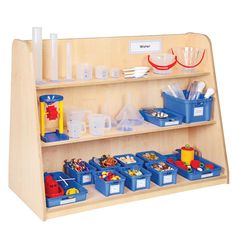 a wooden shelf filled with plastic containers and cups