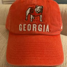 University Of Georgia Hat- Nike. Brand New With Vintage Uga On Front And Athens, Ga On The Back. Great For Men Or Women. Adjustable Back, One Size. Go Dawgs! Nike Baseball Cap, One Size Fits Most, Casual Nike Baseball Cap, Nike Adjustable Cotton Hat, Adjustable Nike Cotton Hat, Adjustable Cotton Nike Hat, Casual Red Baseball Cap For Fans, Casual Baseball Cap For Fan Gear, Red Casual Hats For Sports Events, Casual Red Hats For Fan Gear